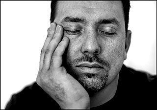 Rondall with his bearded face resting on his hand