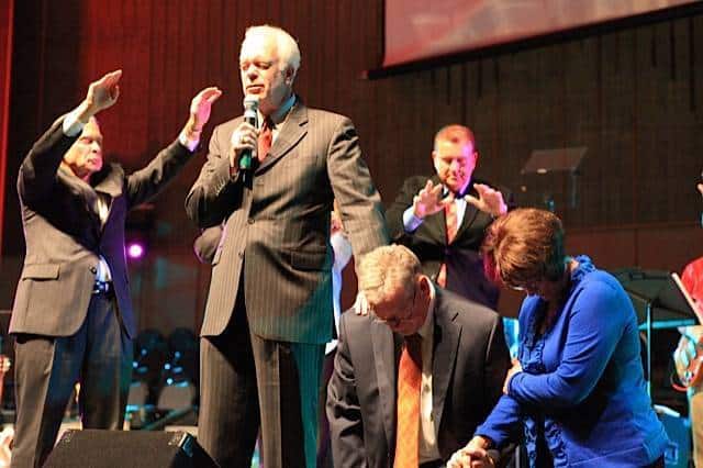 Louisiana College Executive Committee looks to extend Joe Aguillard's contract David Hankins laying handson Joe Aguillard