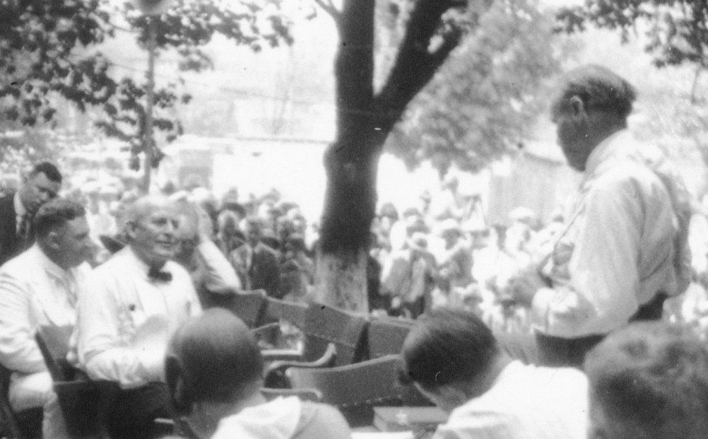 Profundity and Absurdity The black and white image shows the outdoor proceedings of the Scopes trial with multiple men dressed in white dress shirts.