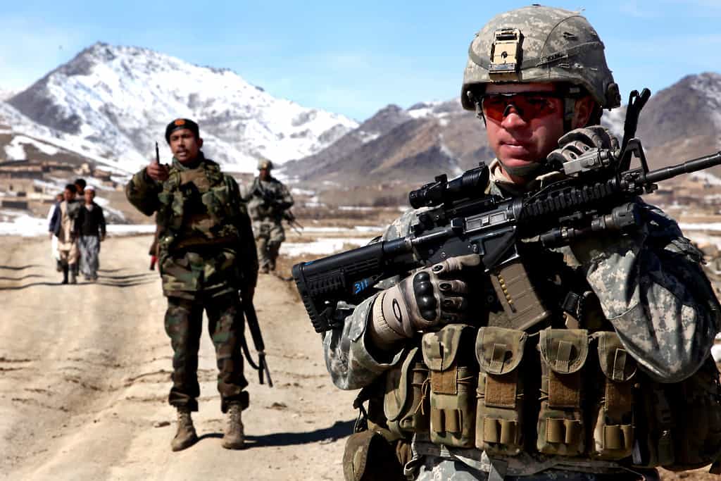 “Marching as to War” Why do American Evangelicals celebrate bloodshed? US troops in Afghanistan are shown in fatigues and with guns.