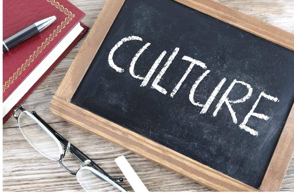 Transforming culture? A Culture War v. culture making question The word "culture" is written on a small wood framed chalk board with a pair of glasses in the foreground and a red notebook with a black pen set on top off to the left.