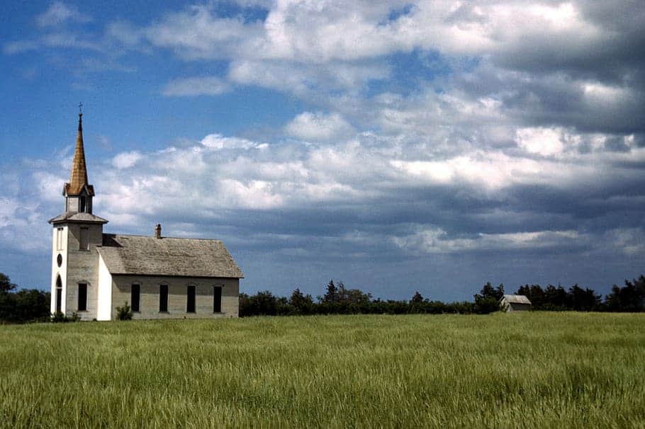 1943-church-clouds-field