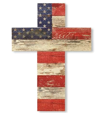 a cross made out of weathered looking wood painted red white and blue in a mock up of a partial United States flag