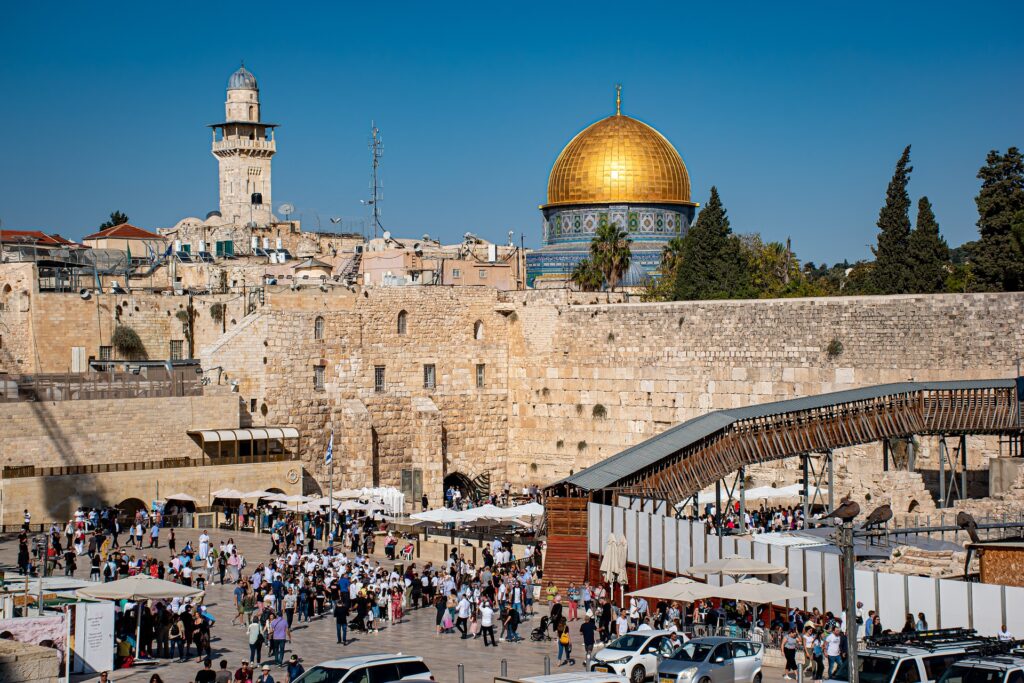 Report: Christian population is increasing in the Holy Land Image shows a street view of Jerusalem with the Dome of the Rock in the distance.
