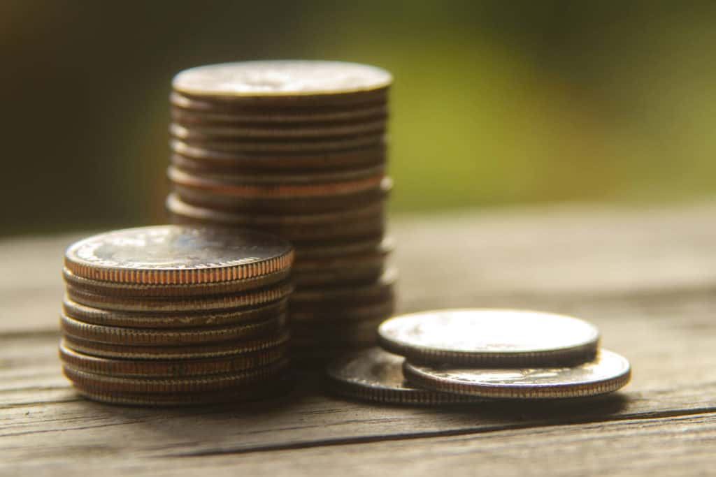 Christianity Today criticized over non-profit status Photo shows three stacks of varying heights of what appear to be US quarters, or 25 cent coins.