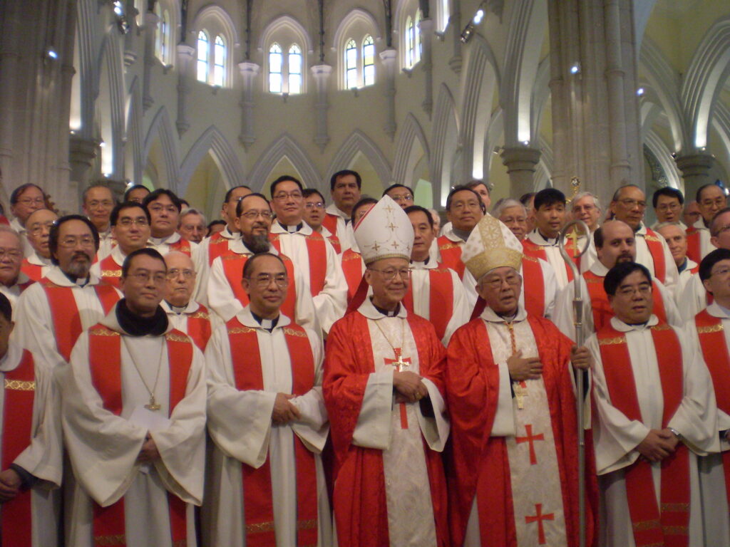 Hong Kong’s Cardinal Joseph Zen visits the Vatican after passport temporarily returned A group of Roman Catholic's from Hong Kong are shown with a couple high ranking men.