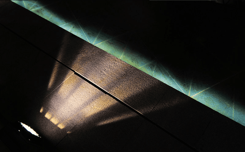 Beth Moore Reflects on ‘Christian Celebrity Culture’ Image appears to be an nearly upside down image of a cement arena walkway lit at night.
