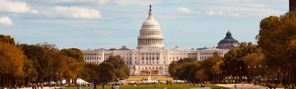 Percentage of Christians in Congress far higher than general population A panoramic image of a street view of the DC capitol dome in warm light.