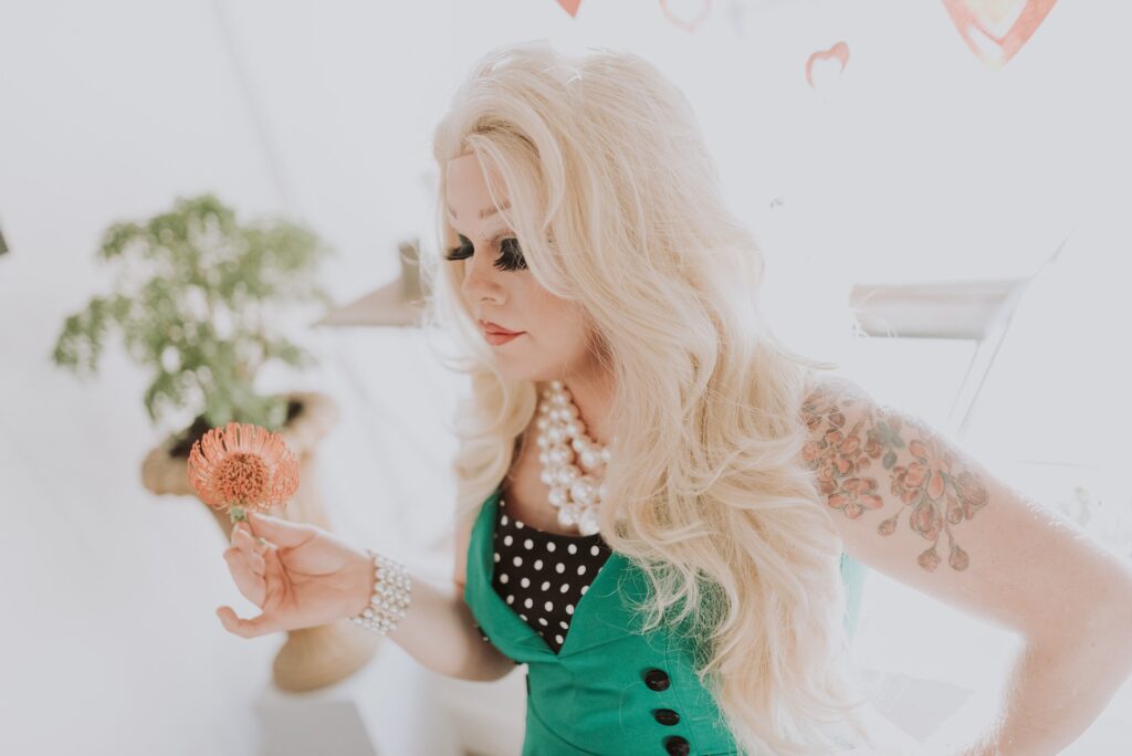 Christian campaigner starts petition to prevent Tate’s drag queen story hour A drag queen is shown, in a green dress and with blonde hair.