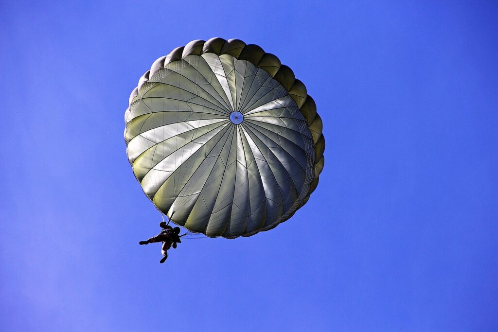 North Carolina preacher celebrates 98th birthday by skydiving A person is shown from below dangling from a white, fully expended parachute.
