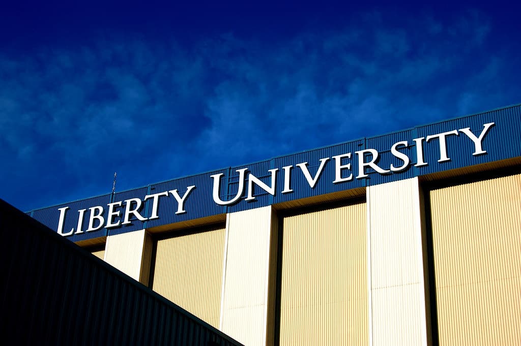 Falwell Jr. sues Liberty University A sign for Liberty University is shown on a building.