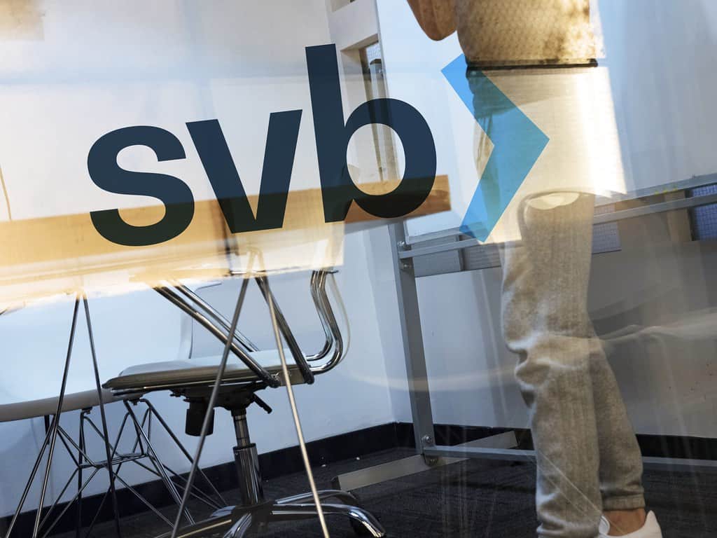 The logo of Silicon Valley Bank is shown on glass.