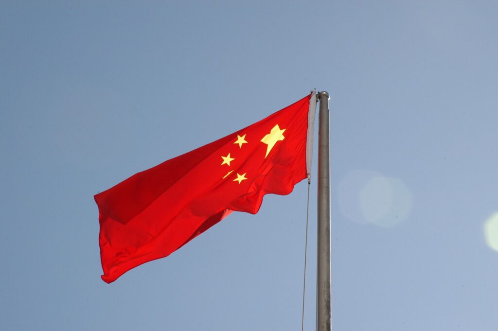 China asserts control over Catholic Church, appoints Communist Party loyalist as bishop The flag of China waves against a grey sky.