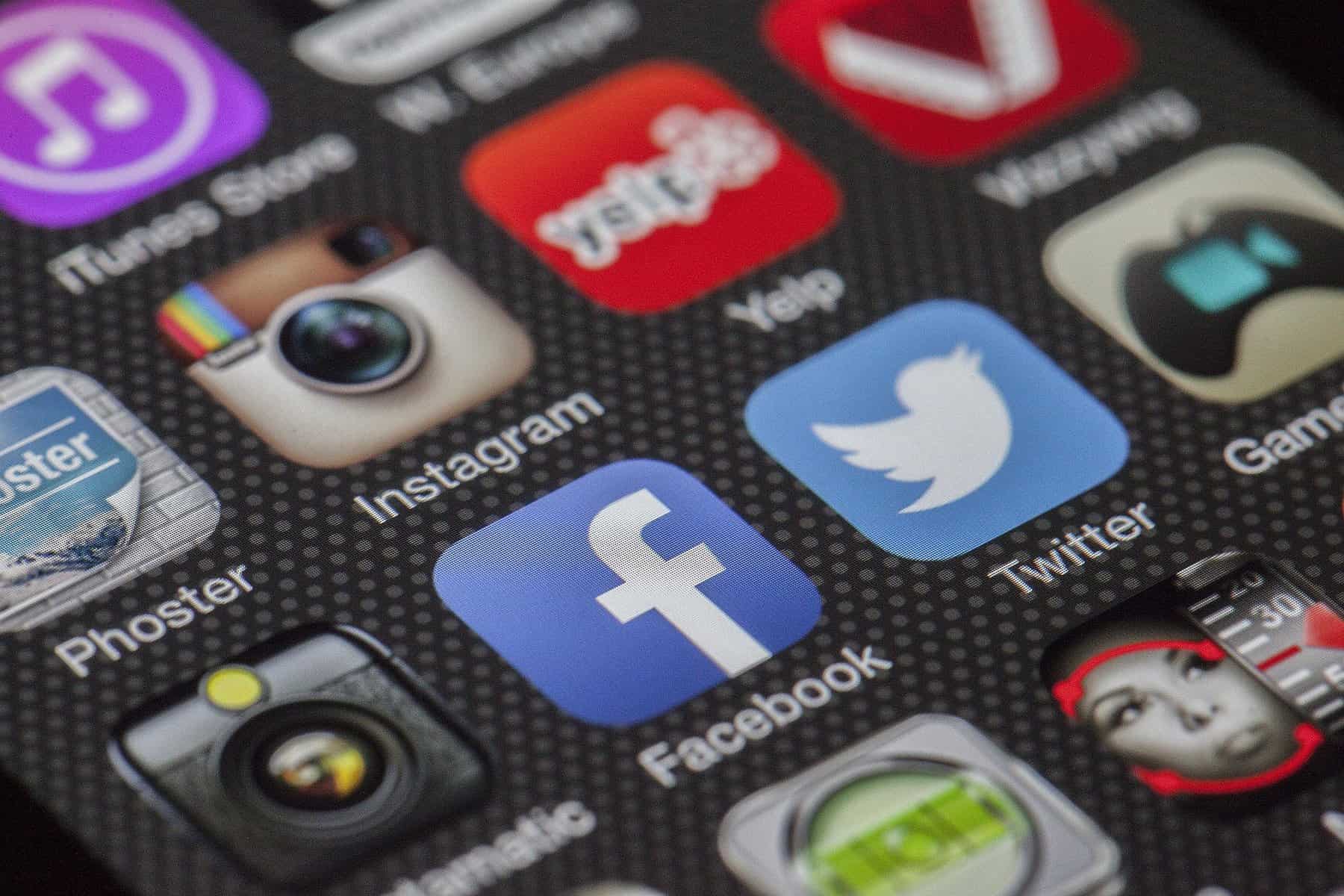 Popular social media icons are shown on a screen.