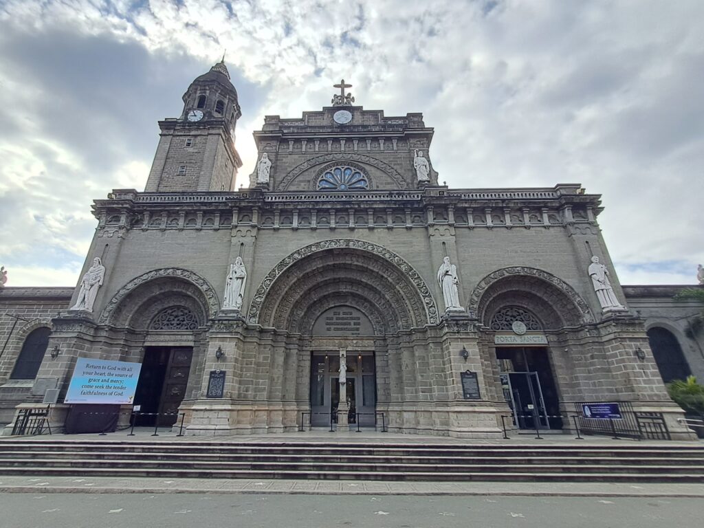 Filipino Christians untangle colonial legacy Manila Cathedral is shown from the street.