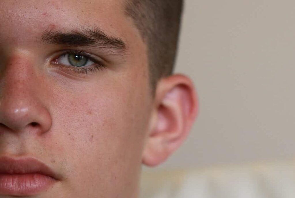 Southern Baptists call on states to prohibit gender transition for minors Half of a boys face is shown, from the nose over. He has unsmiling full lips, blue eyes, and a buzz cut for his dark brown hair. He is looking at the camera.