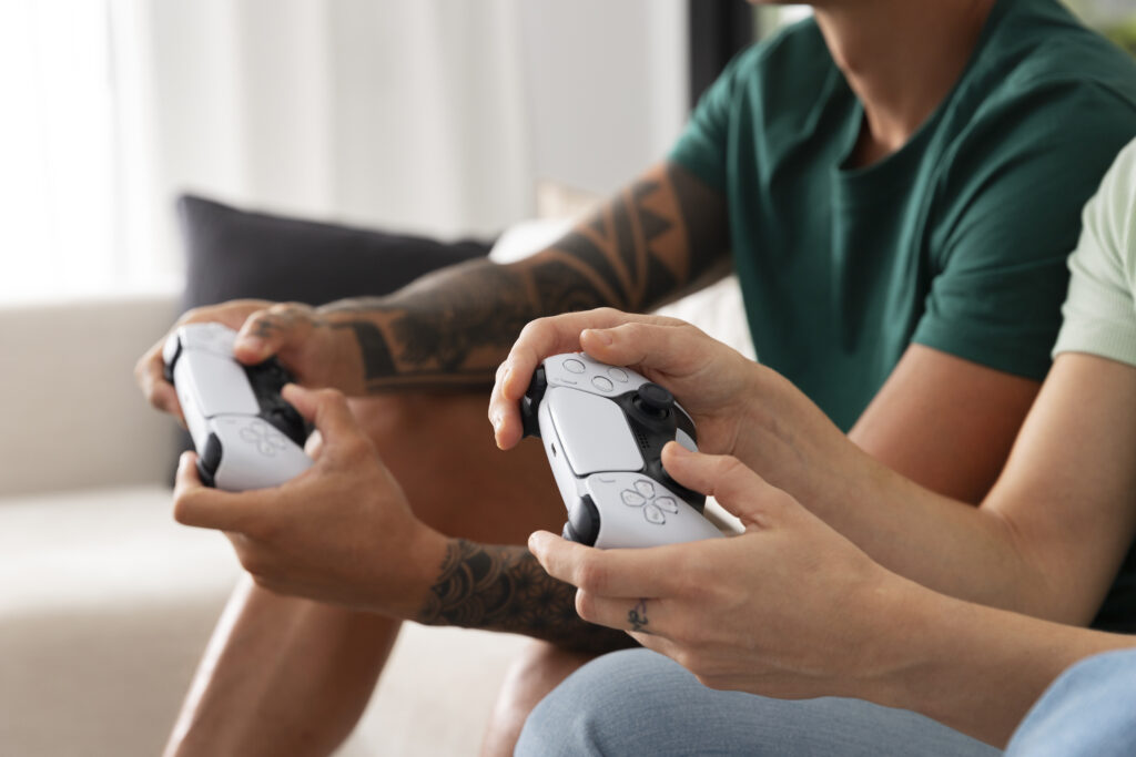 Kickstarter Bible game gains massive support Two people's hands are seen holding game controllers.
