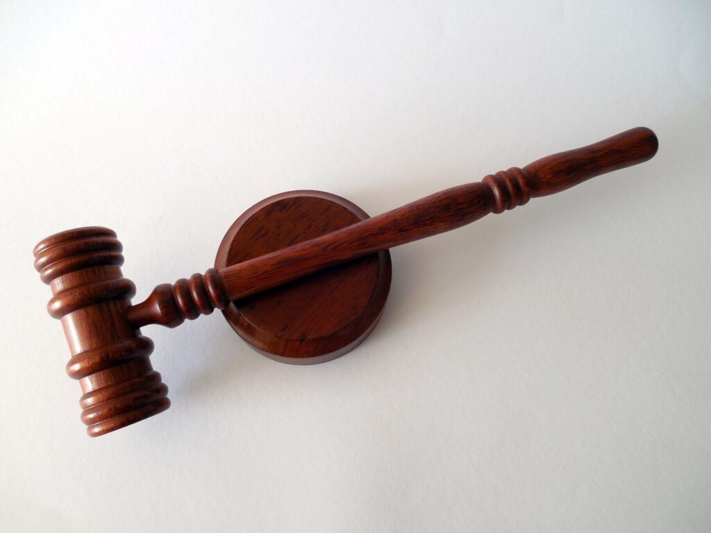 Appeals court protects Christian-owned business from LGBT bias claims A brown wooden gavel and it's pedestal are shown from directly above against a white background.