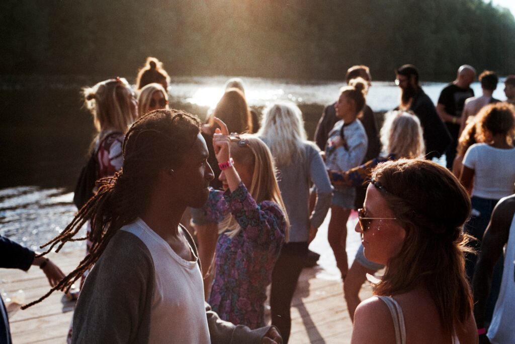 Oregon Revival: Unites 53 churches, 600 individuals choose Christ A group of people are shown outside with a low sun behind them.