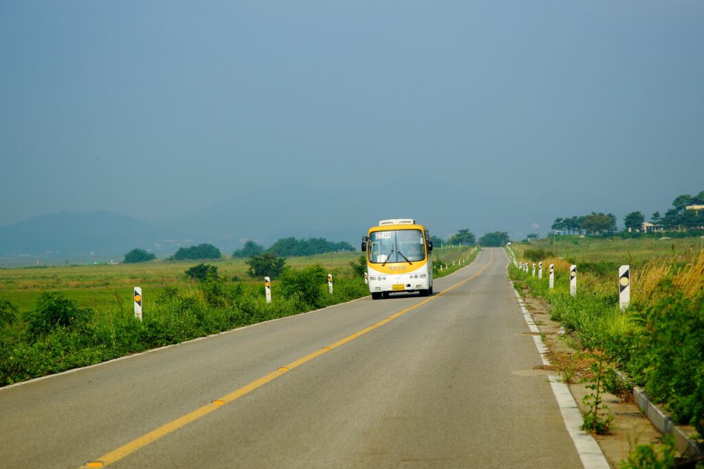 'Hel' bus route number altered to avoid association with Devil A bus is seen coming down a road toward the camera from a distance.