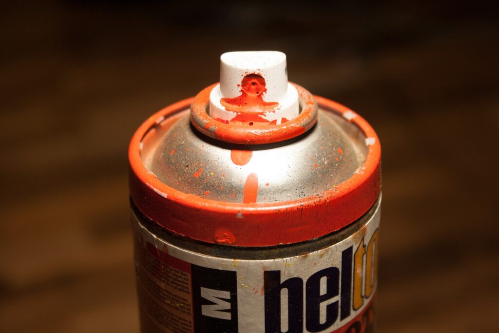Christian monument defaced at Williams College with ‘Hail Satan’ phrases The top of a used spray-paint can is shown covered in it's orange paint.
