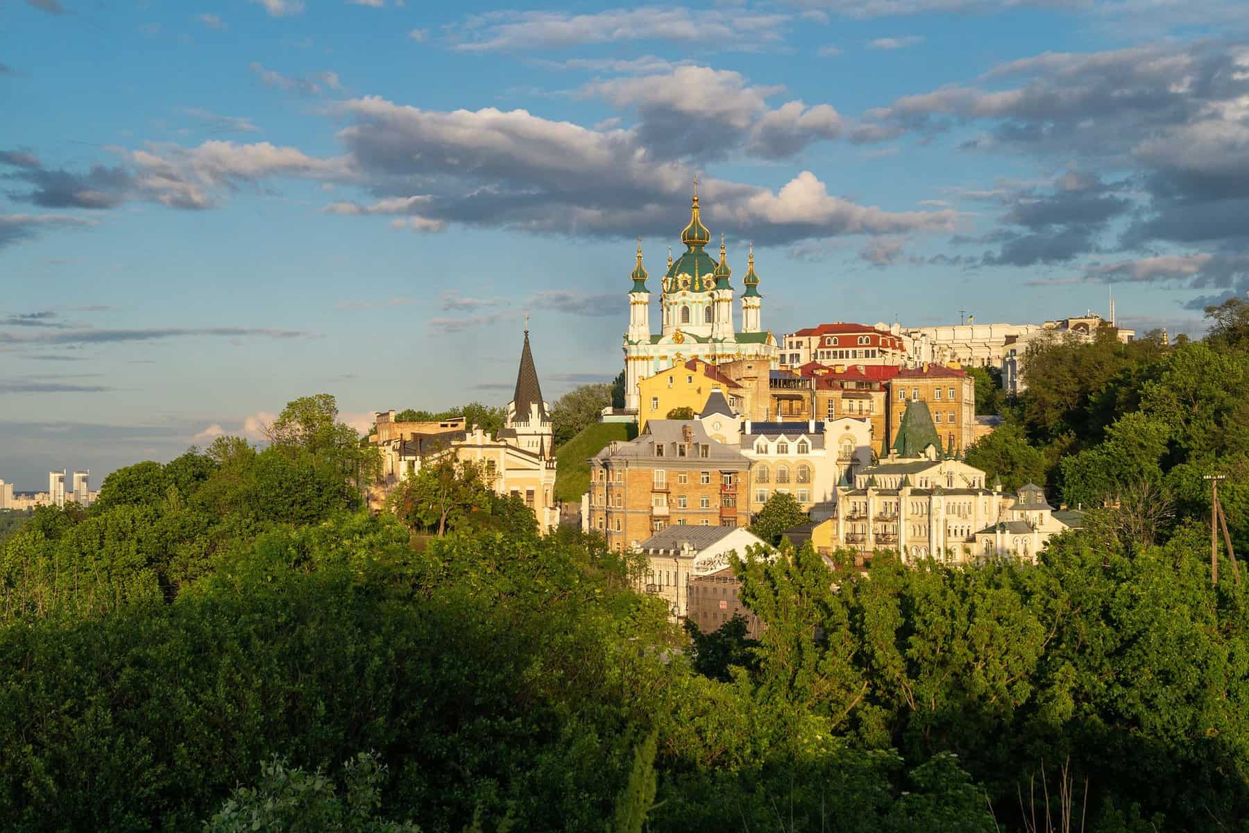 Kiev, Ukraine is seen from a distance in warm light.
