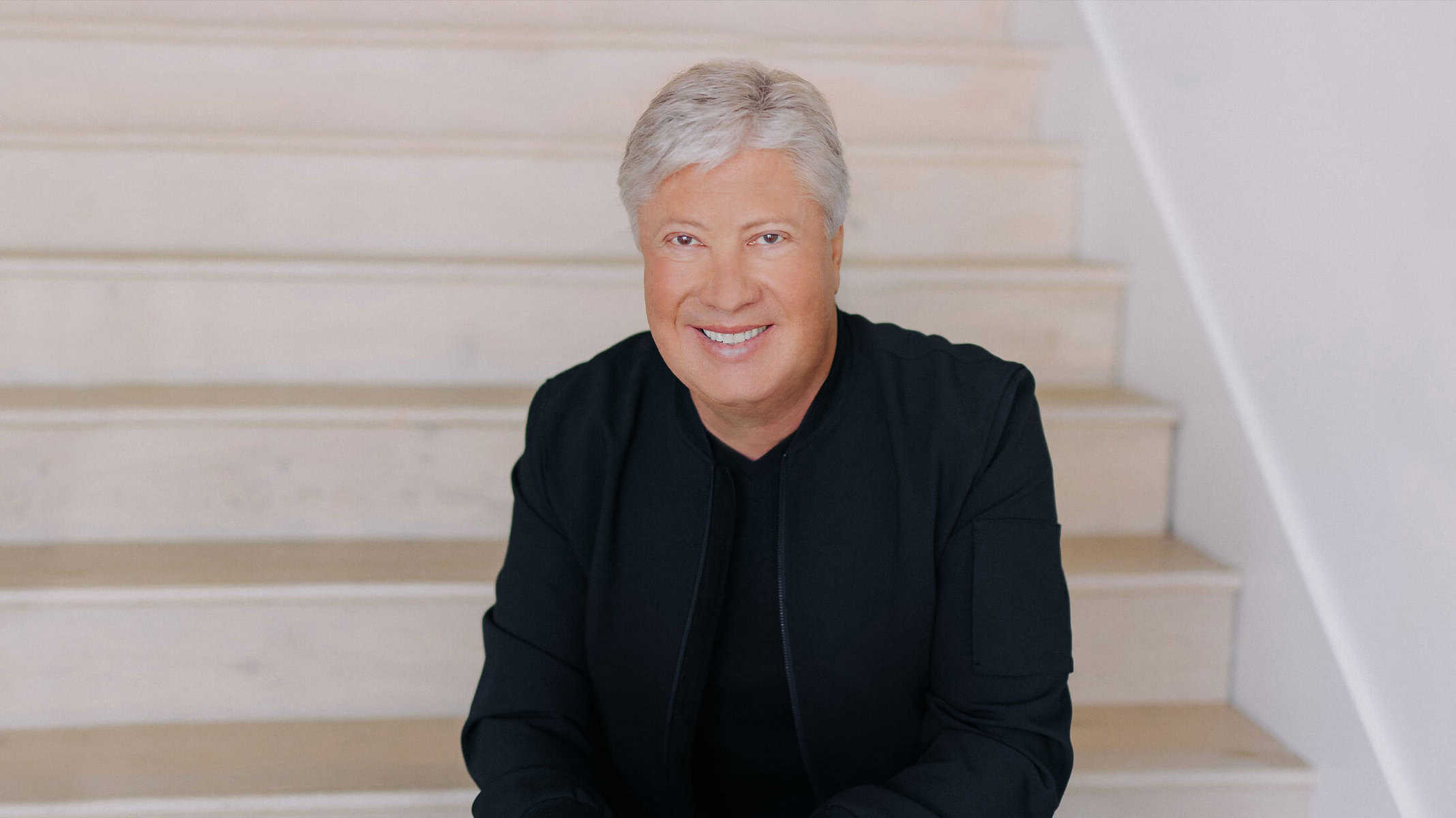 Gateway Church pastor Robert Morris sit's on steps for a photo.