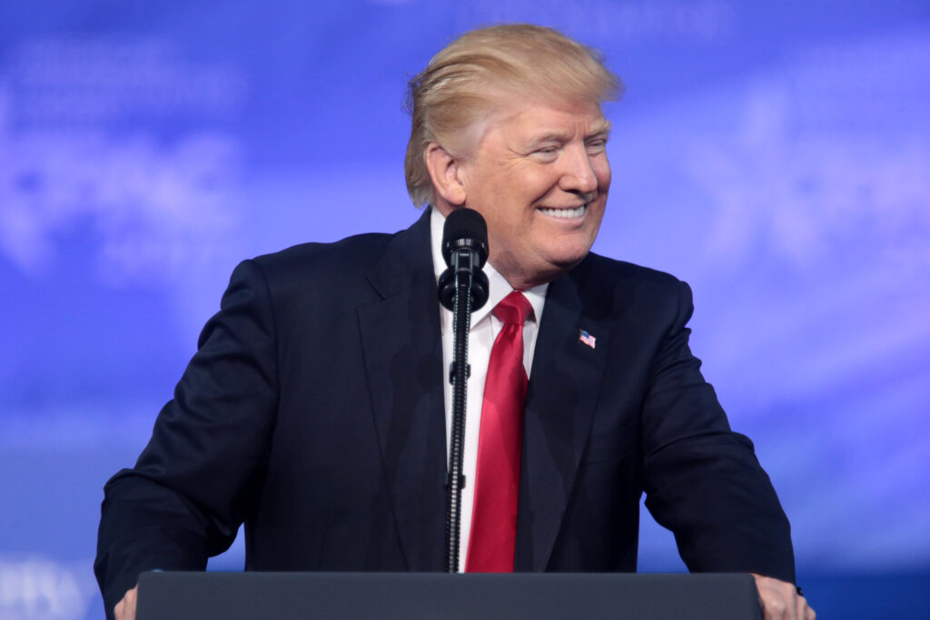 Trump Speaking at a podium.