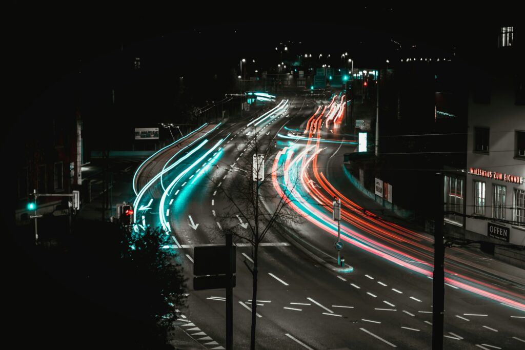 Art or Sacrament? The truth behind Lucerne's AI Jesus Slow shutter speed image showing automobile light trails at night on an road in Switzerland.