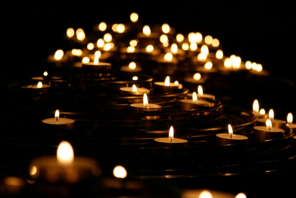 Violence against Christians in Mexico: Priests and Evangelicals targeted Many lit candles in low light.