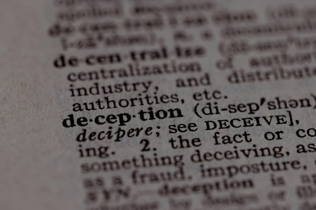 Power, Deception, and Faith: The rise of the modern Antichrist spirit The word deception written in a dictionary.