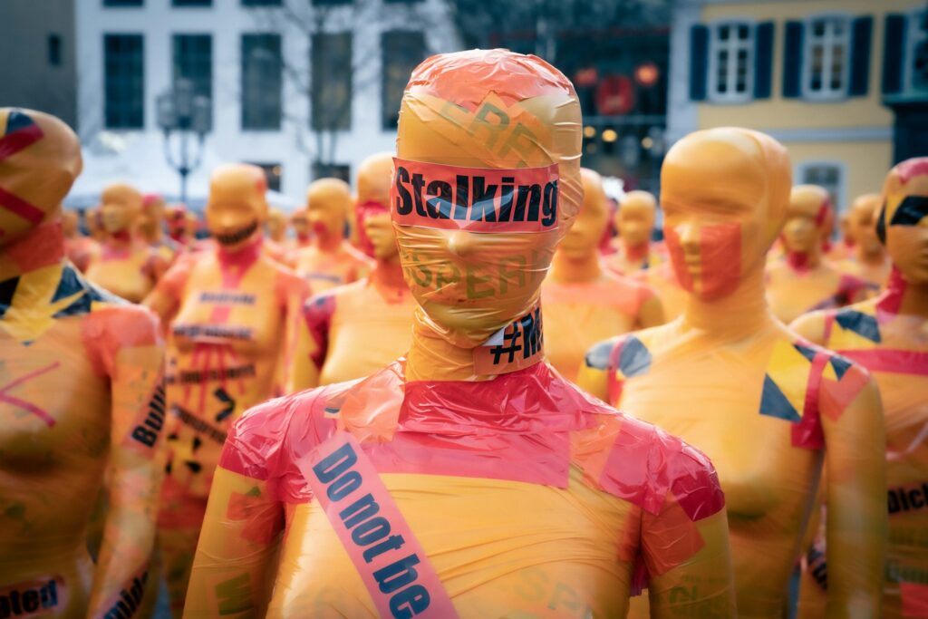 Ex-Megachurch pastor found guilty after stalking former church member Yellow mannequins wrapped in red tape.