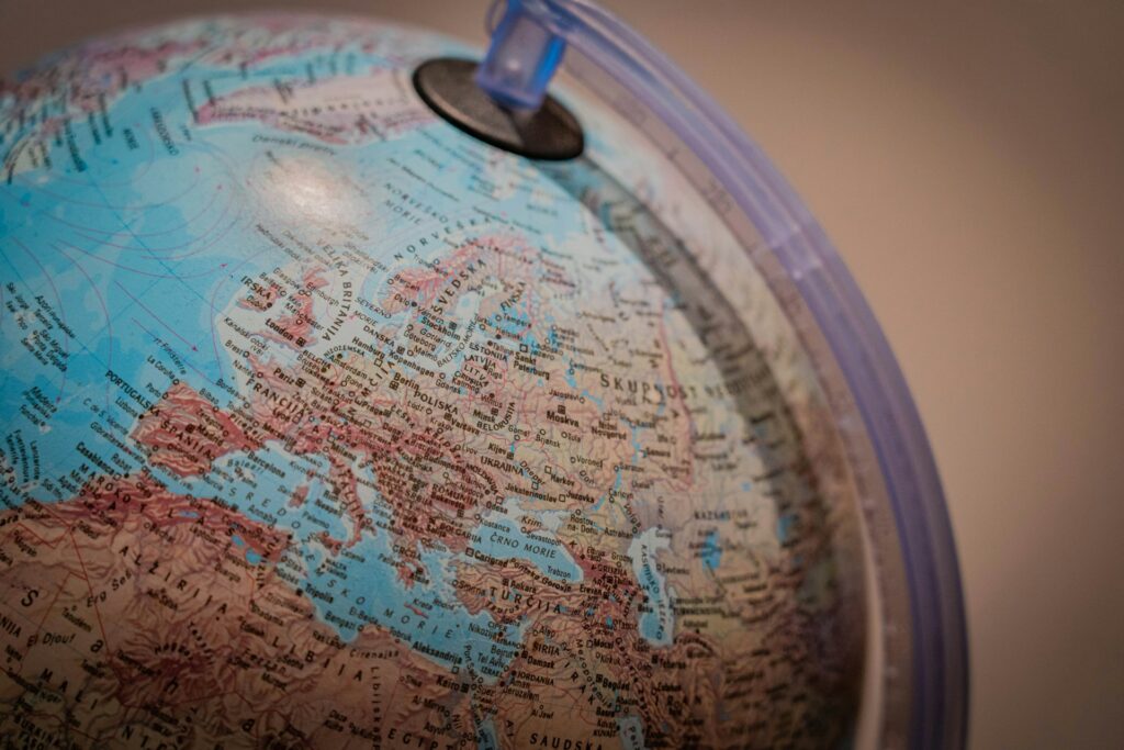 Close up of the top and side of a non-English language globe.