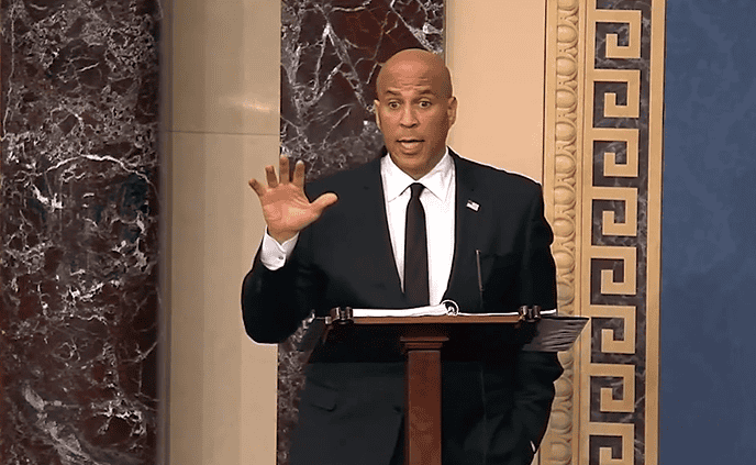 Senator Cory Booker speaks on the Senate floor at the end of 25 hours.