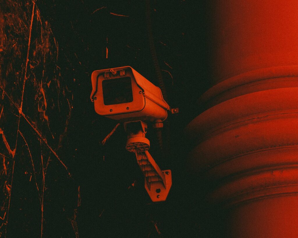 Michael Brown investigation reveals patterns of evasion and misconduct Surveillance camera in red light.