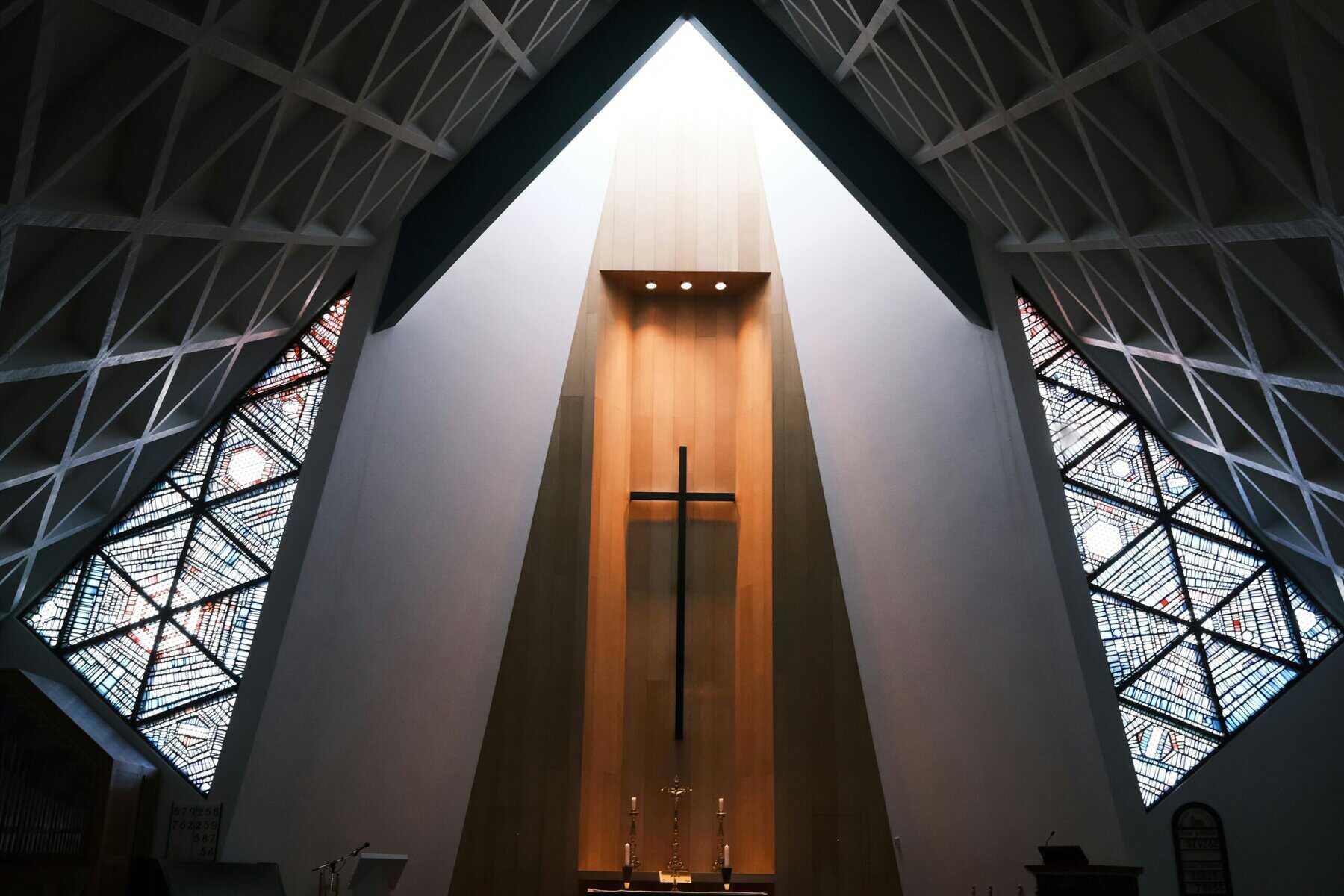 A large cross at the front of a church.