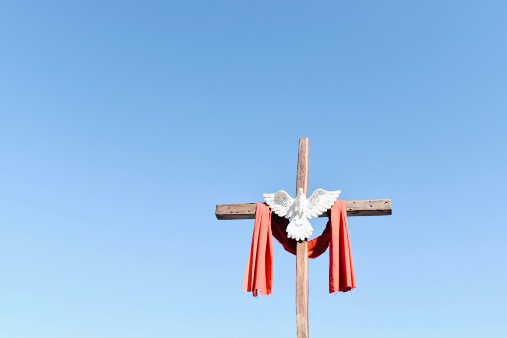 A white dove on a cross.