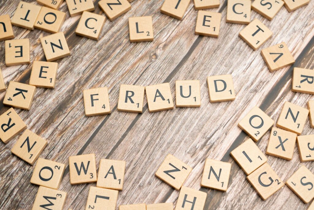 Arizona pastor and church indicted in $60M Medicaid fraud scheme Scrabble tiles spell the word fraud.