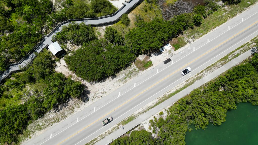 Sheriff: More victims possible in Florida child sex abuse case Cars seen from above driving down an ocean front road.