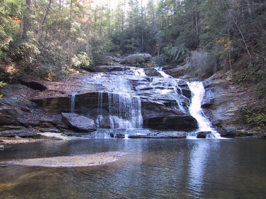 The song of praise I did not sing Wide_waterfall_into_shallow_pool