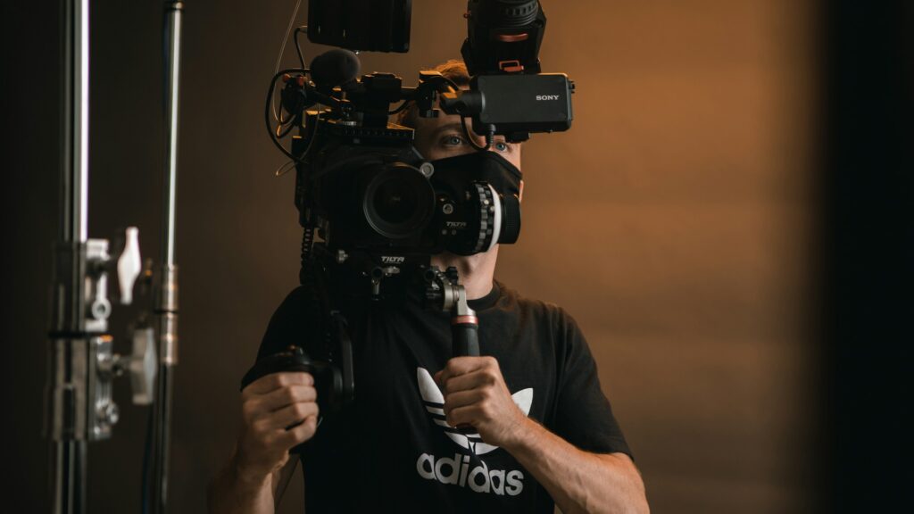 A filmmaker behind a camera rig.
