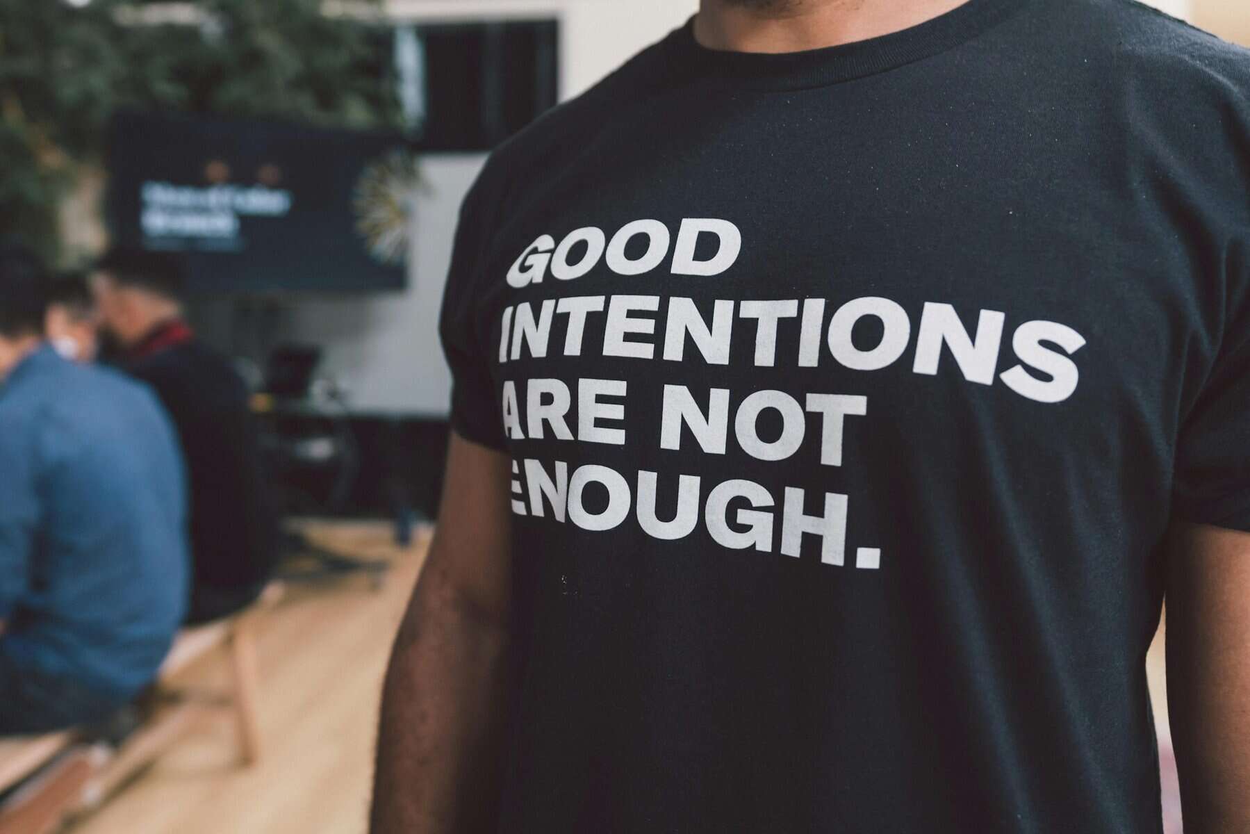 T-shirt that says good intentions are not enough.