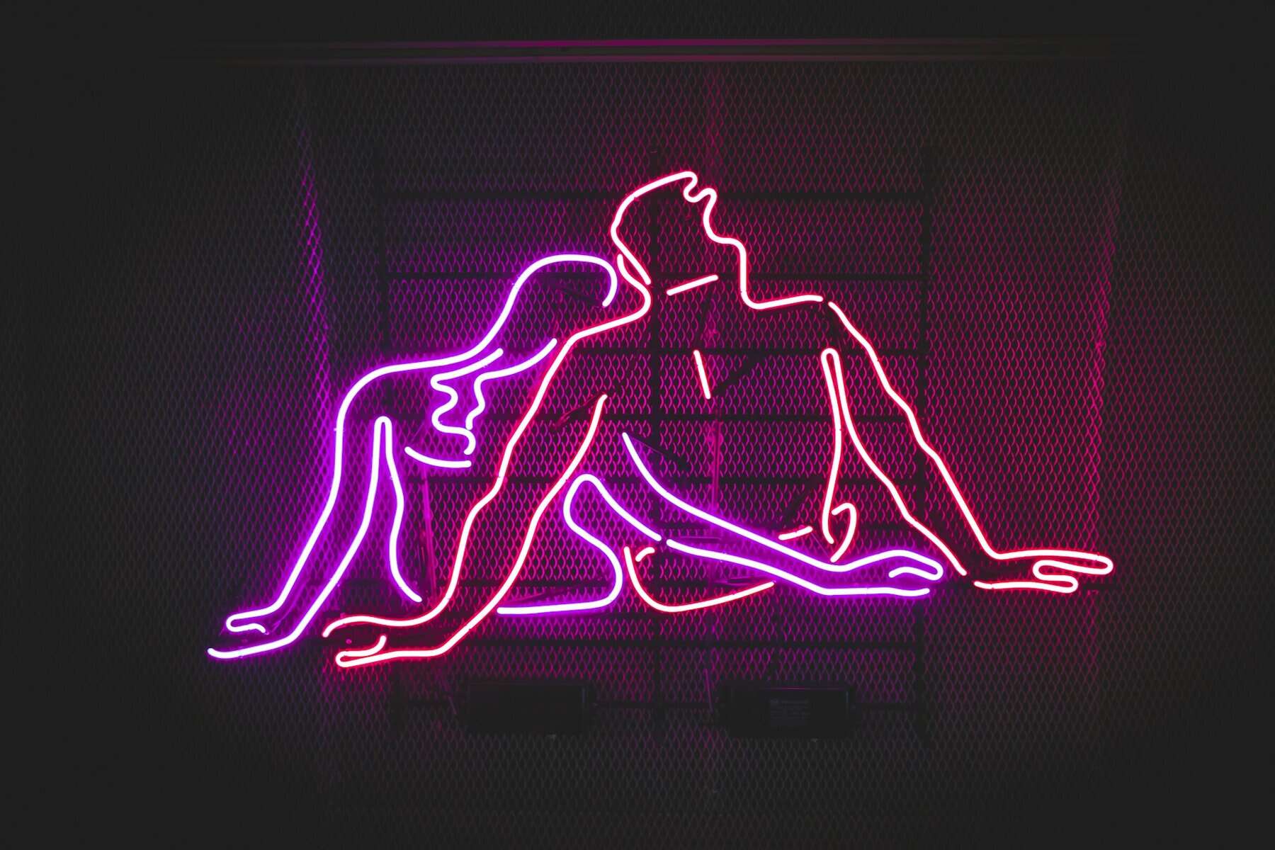Neon sign of man and woman.