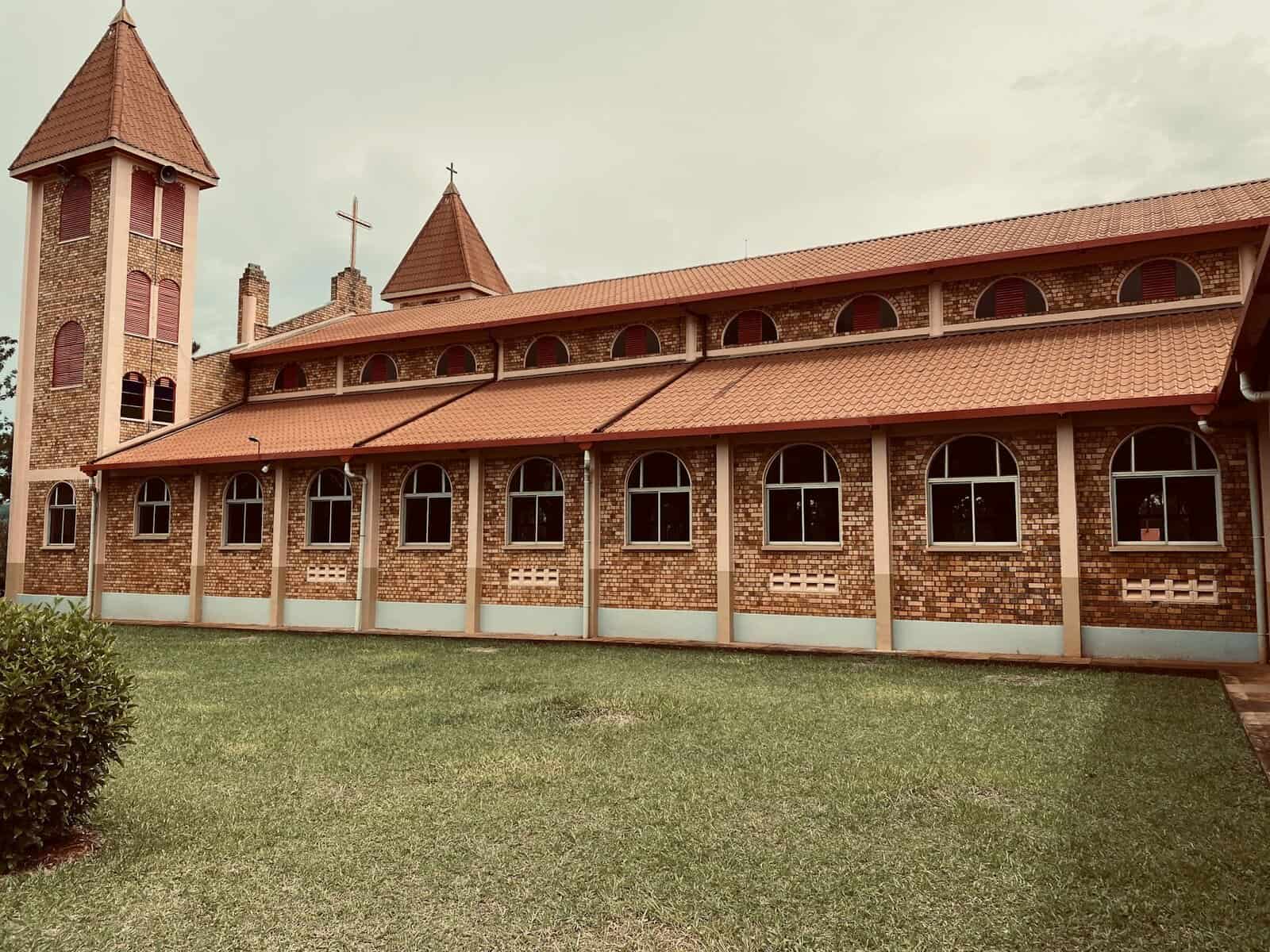 A long brown stone church.