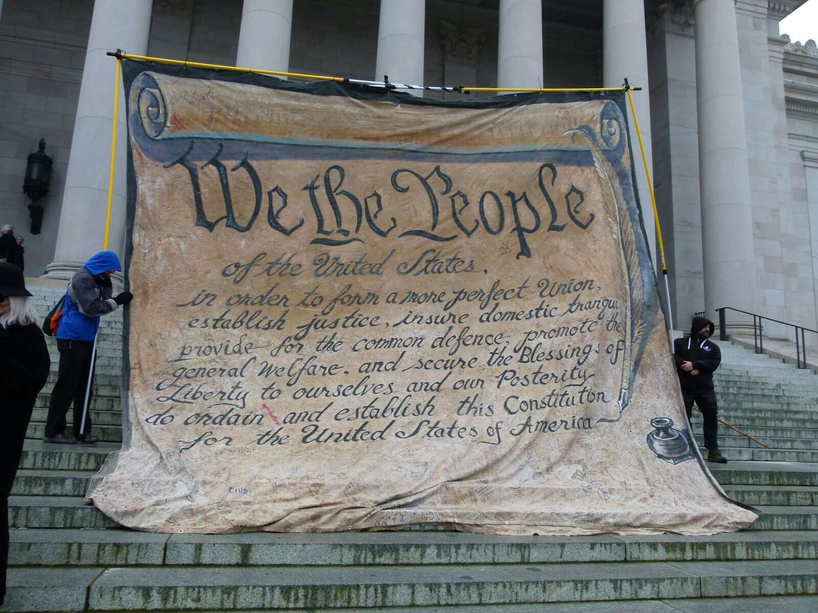 First paragraph of the US Constitution on the steps of the capitol.