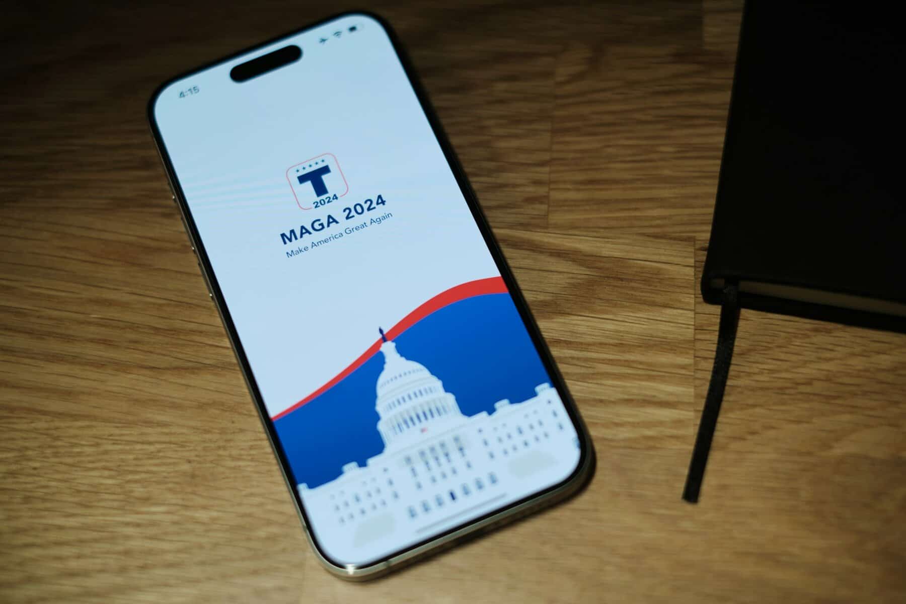 A phone with a MAGA site showing sitting next to a bible. Evangelicals leaving MAGA.