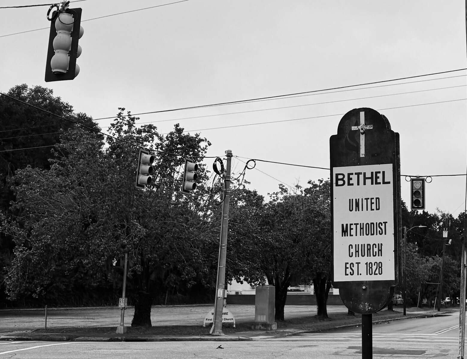 A sign for Bethel United Methodist Church in a black and white photo.