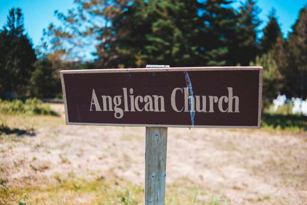 Judge partially sides with JAFC in Anglican chaplains dispute A nondescript brown sign with "Anglican Church" in white lettering.