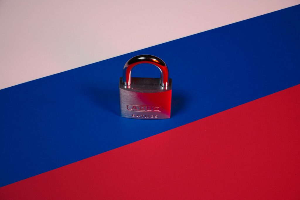 Russian flag with a closed padlock on top.