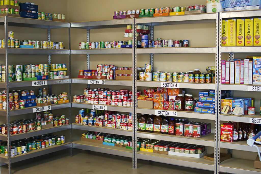 Food pantry shelves with a selection of items.